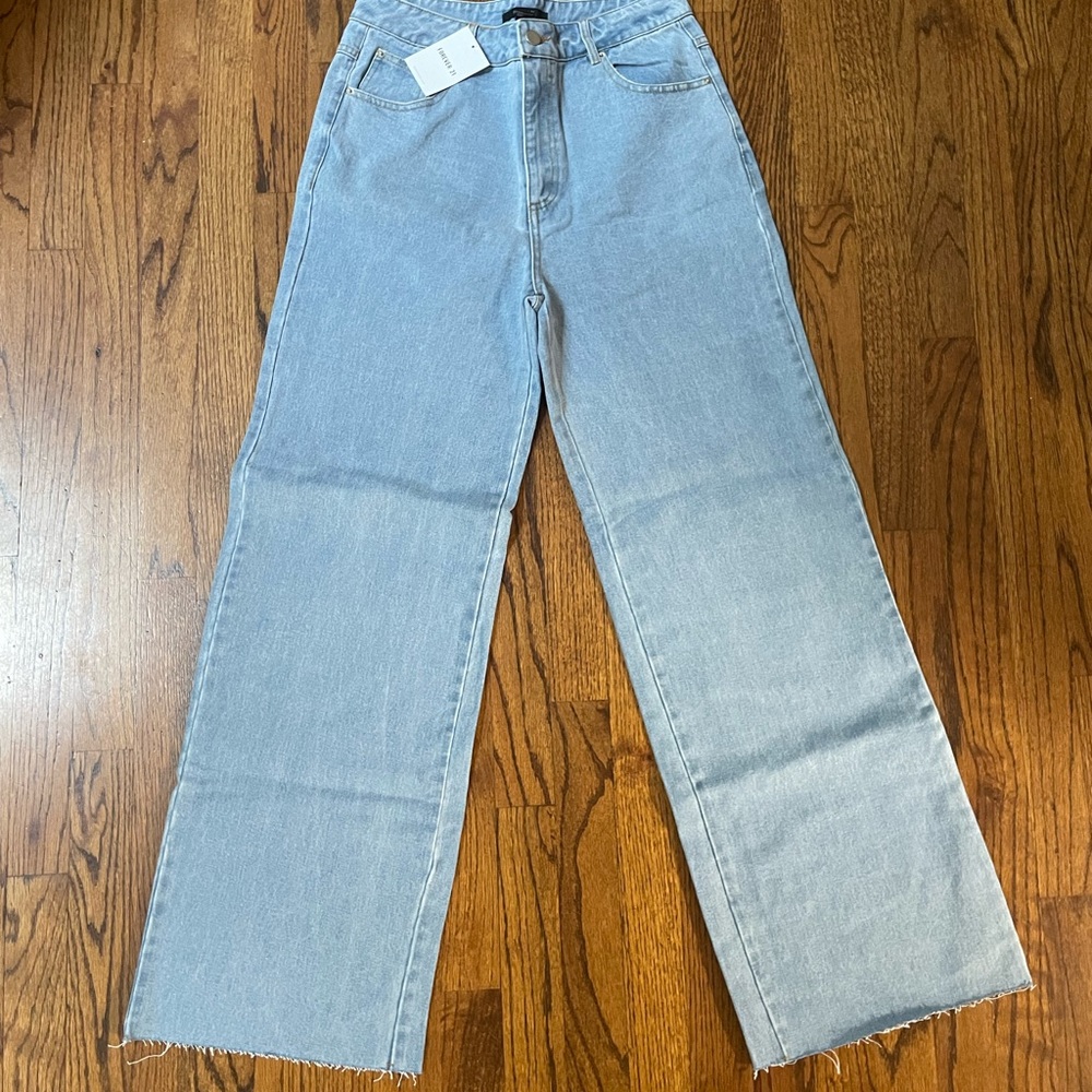Never worn, with tags wide leg jeans size medium fits like a 27/28